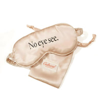 Beige sleep mask with 'No eye see.' text on a white background