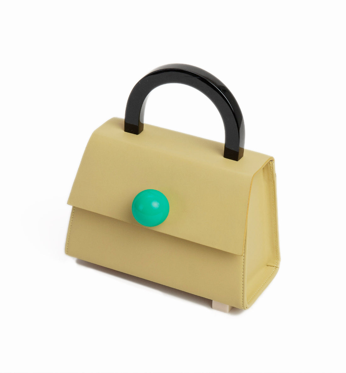 An olive green satchel bag with a resin handle and asymmetric resin studs at the bottom. It features a removable shoulder strap and a green sphere on top.