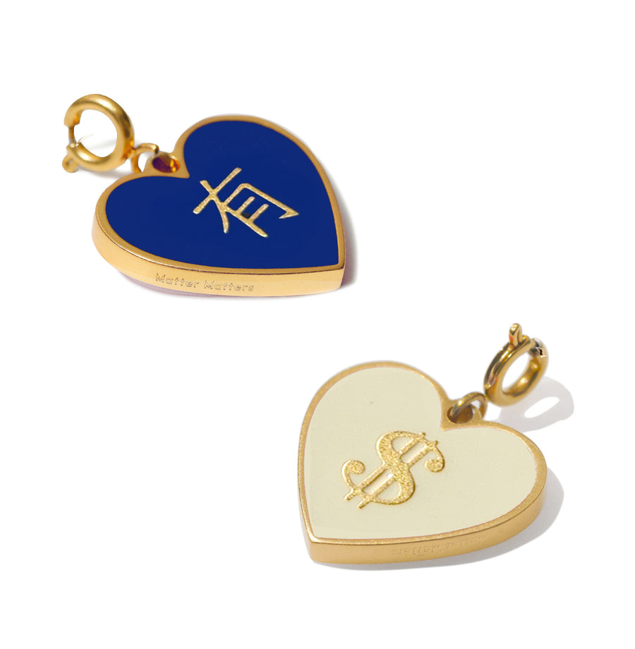 Two heart-shaped charms, one blue with gold lettering have and one beige with gold lettering money dollar sign, on a white background.
