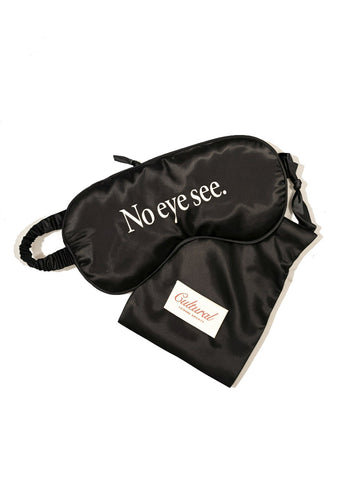 Black sleep mask with 'No eye see.' text and a matching pouch on a white background